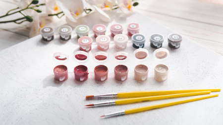 A set of colorful gouache for painting by numbers, pastel colors, drawing on canvas. Concepts of leisure activity, hobby and relax. selective focus. close up.の写真素材