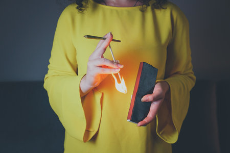 Close-up of adult woman lights up with matches and smoking medical marijuana joint. Concept of herbal and alternative medicineの写真素材