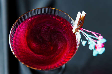 Alcoholic drink. A cocktail with elite alcohol on dark black background, close-up. Concept of...