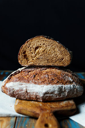 Freshly baked bread with a golden crust close up. Yeast dough. Concept of bakery products, bakery...