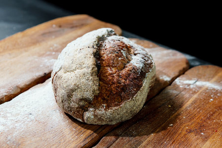 Freshly baked bread with a golden crust close up. Yeast dough. Concept of bakery products, bakery...