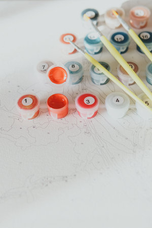 A set of colorful gouache for painting by numbers, pastel colors, drawing on canvas. Concepts of leisure activity, hobby and relax. selective focus. close up.の写真素材