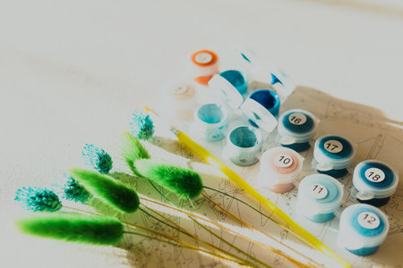A set of colorful gouache for painting by numbers, pastel colors, drawing on canvas. Concepts of leisure activity, hobby and relax. selective focus. close up.の写真素材