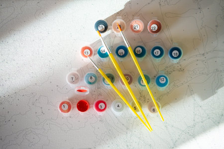A set of colorful gouache for painting by numbers, pastel colors, drawing on canvas. Concepts of leisure activity, hobby and relax. selective focus. close up.の写真素材