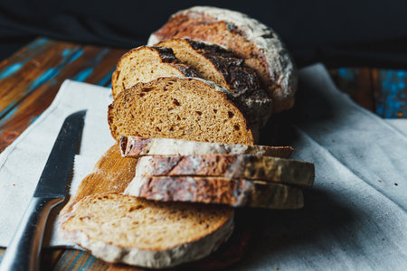 Freshly baked bread with a golden crust close up. Yeast dough. Concept of bakery products, baking and healthy eatingの写真素材