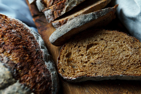 Freshly baked bread with a golden crust close up. Yeast dough. Concept of bakery products, baking and healthy eatingの写真素材