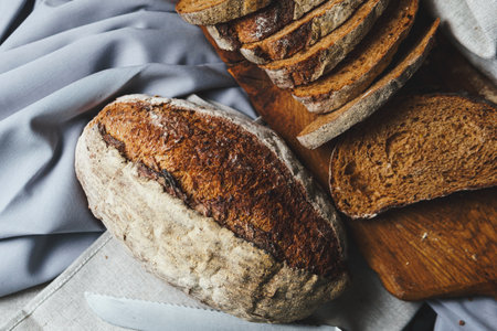 Freshly baked bread with a golden crust close up. Yeast dough. Concept of bakery products, baking...