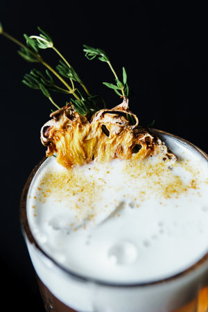 Alcoholic drink. A cocktail with elite alcohol on dark black background, close-up. Concept of...