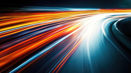 A car speeding down a highway at night, with long-exposure light streaks trailing behind, showcasing high velocity.の素材