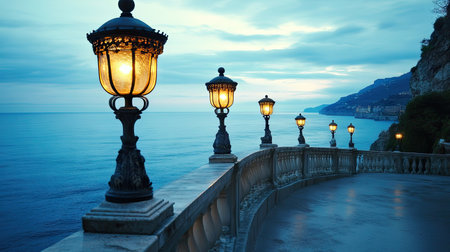 Ornate lanterns along a coastal balustrade, their soft glow contrasting with the cool blue sea.の素材