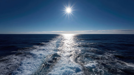 The ocean horizon on a sunny day, where the line of the sea and sky meet in a perfect straight line, creating a sense of infinityの素材