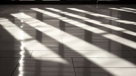 Strong shadows from window blinds falling across a glossy tiled floor, adding dramatic texture and contrast to the sceneの素材