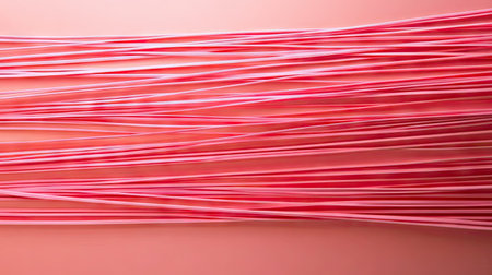Set of rubber bands stretched in parallel lines across a solid background, creating a minimalist striped visual effectの素材