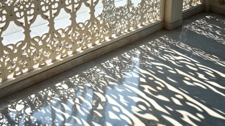Artistic shadows of latticework on a terrazzo floor, forming complex patterns in natural afternoon lightの素材