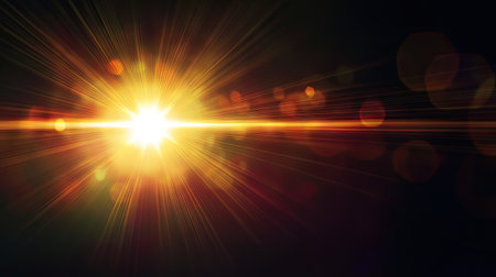Warm natural sun flare bursting through a dark black background, creating vibrant rays and lens flare effects for dramatic lightingの素材
