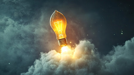 Creative concept of a glowing idea light bulb flying into the sky like a rocket, leaving a trail of smoke, symbolizing innovation and inspirationの素材