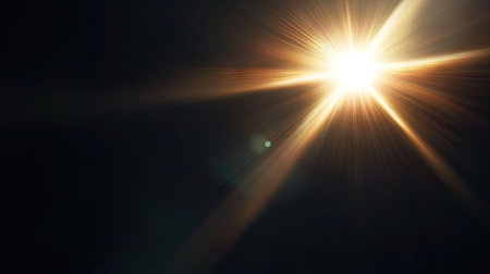 Intense sunlight glare with visible lens flare elements on a black background, perfect for atmospheric and moody designsの素材