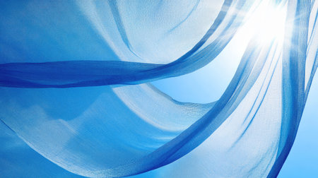 A close-up shot of a beach umbrella's fabric, with a clear blue sky and the sun shining through.の素材