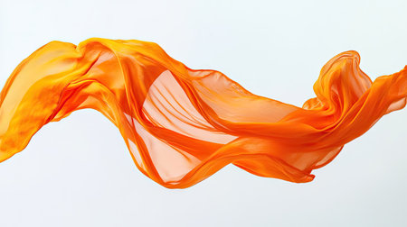 A bright orange t-shirt in mid-air with its fabric swirling gracefully, highlighted against a white background.の素材