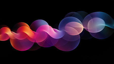Colorful, pulsating light orbs moving in a delicate dance across a black backdrop, glowing softly.の素材