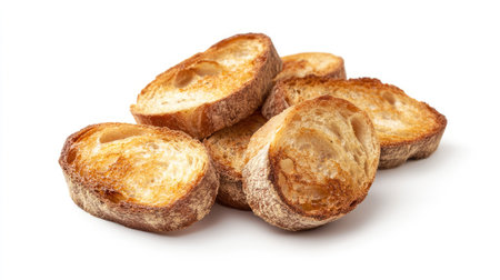 Freshly toasted bread slices forming a small pile, with visible texture and golden color on a plain white backgroundの素材
