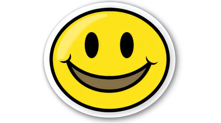 Simple and bold image of a single yellow smiley face sticker with sharp contrast on a white background.の素材