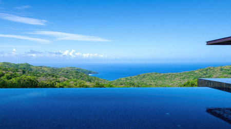 Luxury villa with a sleek infinity pool, overlooking a lush landscape, clear blue skies reflecting in the calm water, no people.の素材