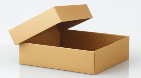 Plain cardboard box open on a reflective white background, showcasing sturdy material, perfect for packing, shipping, or unboxing themes.の素材