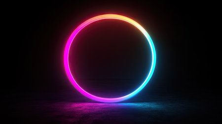 A glowing neon circle with a gradient of bright neon colors, from pink to blue, set against a stark black background. The vibrant glow makes it the focal point of the composition.の素材
