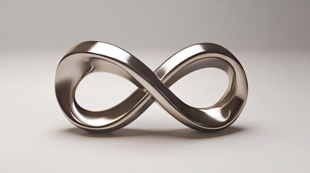 A minimalist infinity symbol formed from two intertwined metallic bands, set against a smooth white background, symbolizing unity and endless connection.の素材