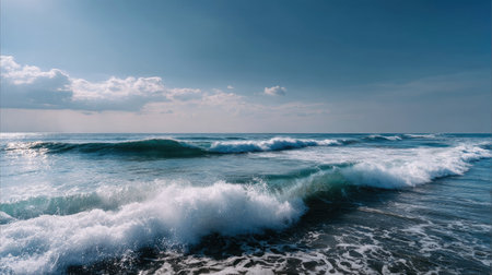 A vibrant view of the ocean horizon with rolling waves meeting the distant sky, creating a dynamic and calming sceneの素材
