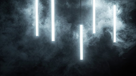 Glowing white fluorescent lights hanging at various angles in front of a smoky black backgroundの素材