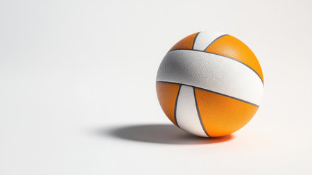 Volleyball positioned slightly off-center on a bright white backdrop, clean and modern for sports-related visuals.の素材