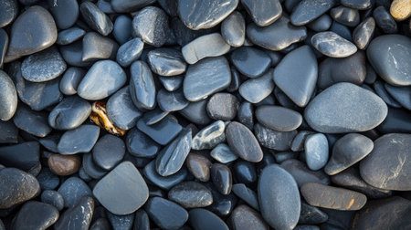 A close-up of flat sea pebbles stacked on each other, creating a peaceful and balanced composition.の素材