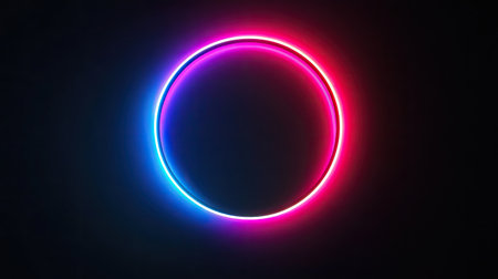 This image features a vibrant neon circle with blue and pink glowing effects set against a dark background, perfect for modern design and creative visual content.の素材