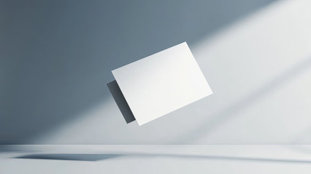 A floating blank white paper sheet creates a modern and serene atmosphere in a minimalistic interior, highlighted by soft shadows and natural lighting.の素材