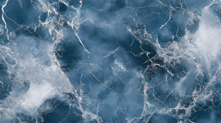 Elegant marble texture with deep and soft ocean blue hues, creating a calming, water-like effect with white lines and swirlsの素材
