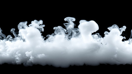 Soft, white smoke puff with delicate swirls on a black background, creating a mysterious effect with floating, ethereal wisps.の素材