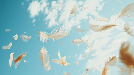 Gently falling feathers suspended mid-air, captured against a luminous blue sky with faint clouds in a tranquil setting.の素材