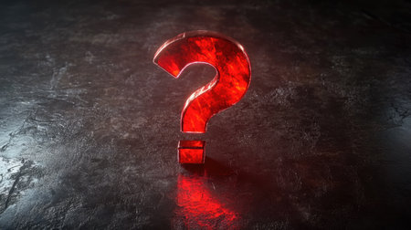 A red question mark symbol placed on a glossy black surface with dramatic lightingの素材