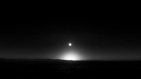 A crescent moon shining in a starless night sky, surrounded by the subtle halo of moonlightの素材