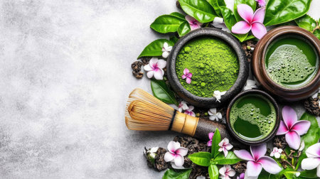A flat lay of matcha ingredients: matcha powder, bamboo whisk, and tea bowl, artfully arranged on a minimalist background.の素材