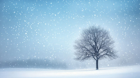 A lone tree in a vast snow-covered landscape, its branches dusted with snowflakes, evoking a sense of tranquility and winter wonder.の素材