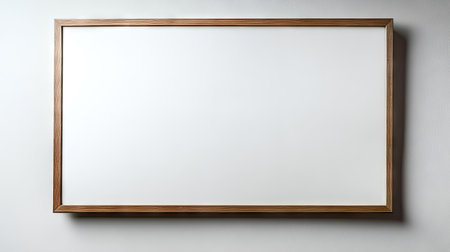This image features a minimalist wooden frame set against a smooth, clean wall, ideal for showcasing artwork or photographs in a stylish interior setting.の素材