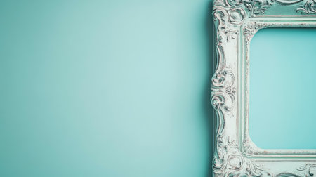 This image features a vintage ornate frame on a smooth teal background, ideal for showcasing artwork or photographs in your modern home decor and design projects.の素材