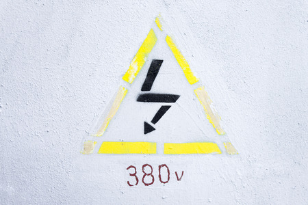 Yellow note high voltage 380 volt on light backgroundの写真素材