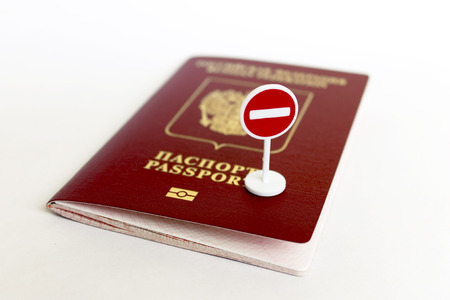 Stop illegal migration concept, Russian passport and stop sign close upの写真素材