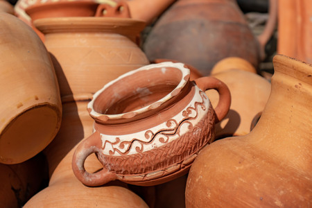 Many ceramic handmade utensils, made of clay, close up