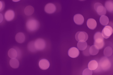 Blurred defocused bright light, shiny spots, lilac background.