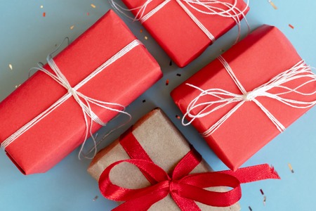 Christmas red and craft gift boxes with white and red ribbons.の写真素材